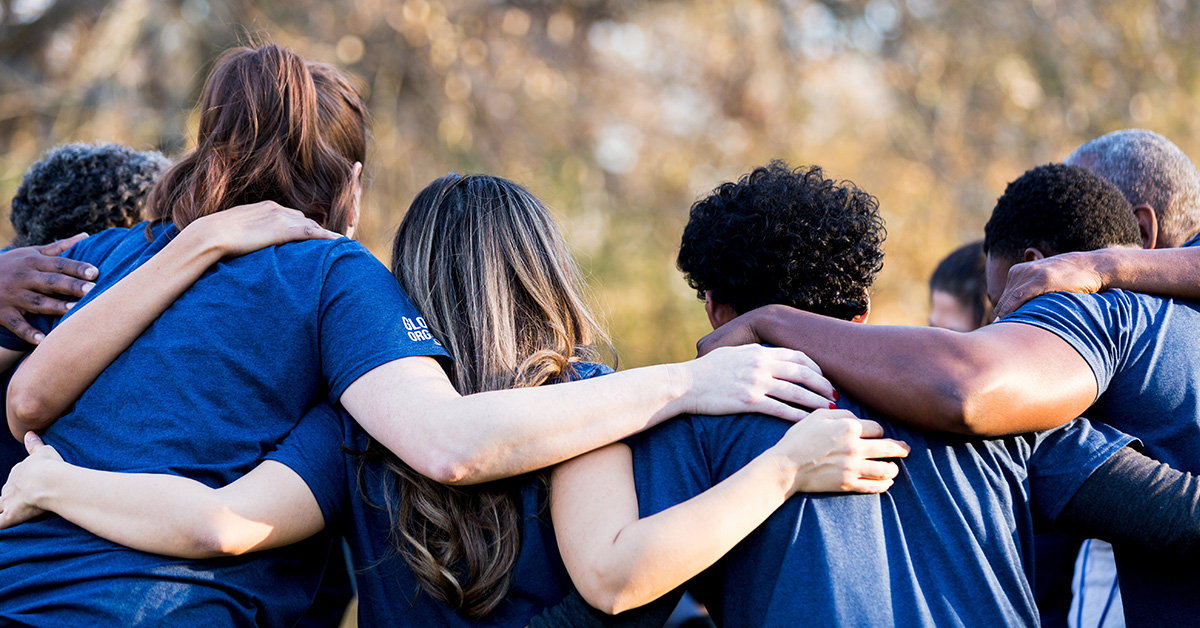 United Way of Central MN volunteers with arms around one another