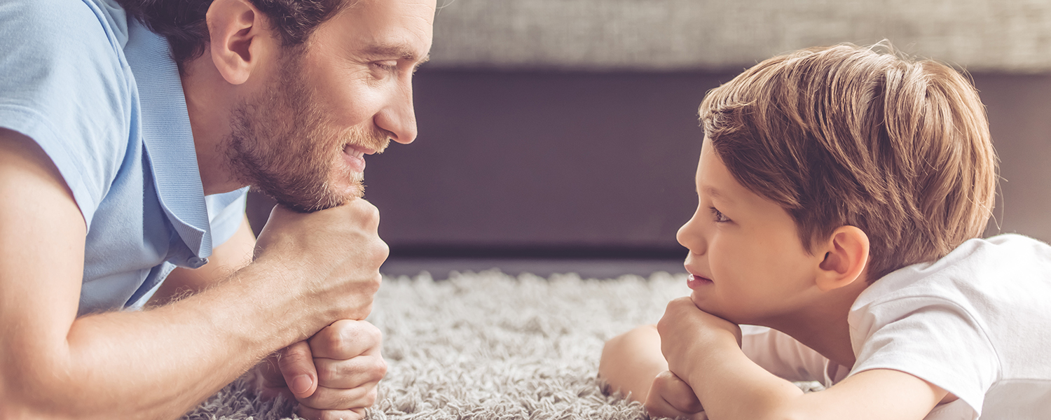 Dad and boy looking at each other